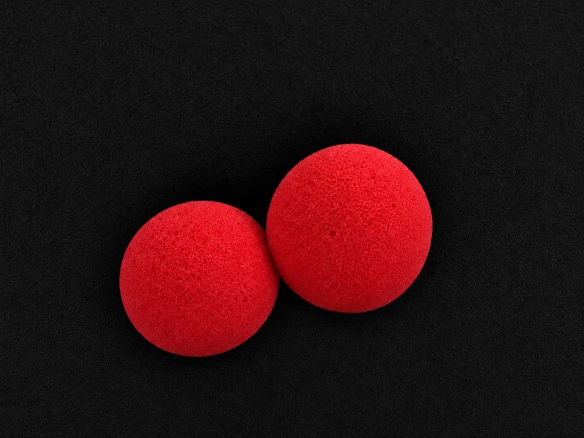 Two red sponge balls used in the children's magic workshop
