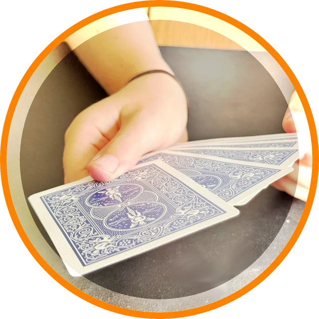 A card trick being taught